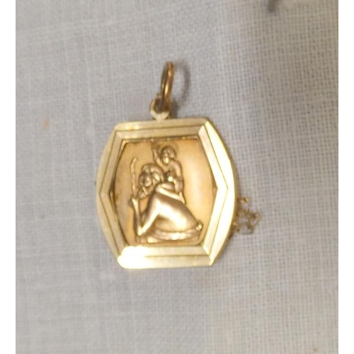 256 - 9ct. gold St. Christopher and chain 4.7g