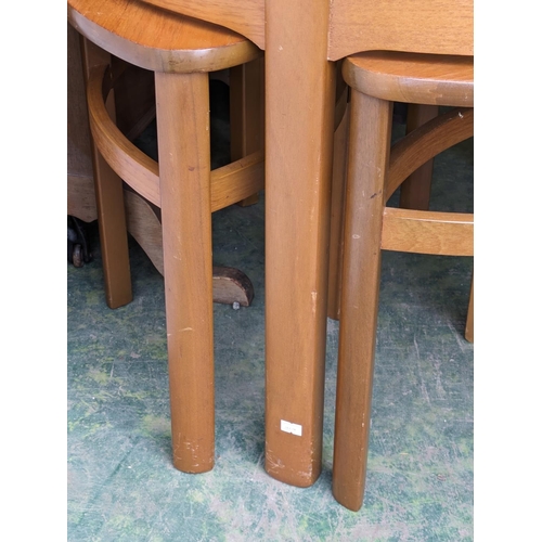 559 - Mid-century teak coffee table with a nest of tables underneath by Nathan.