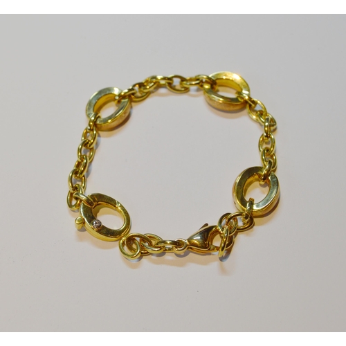 135 - Chimento 18ct gold bracelet with three larger oval links and a diamond-set catch, 18.6g gross.