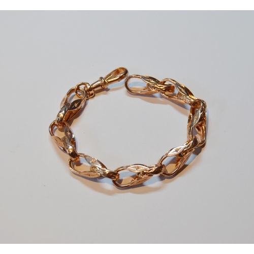 136 - 9ct rose gold bracelet with textured links, 33.2g