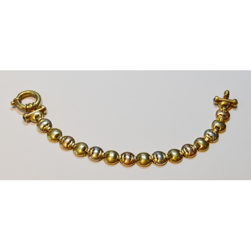 138 - 9ct coloured gold bracelet with hinged button links, 17.4g.