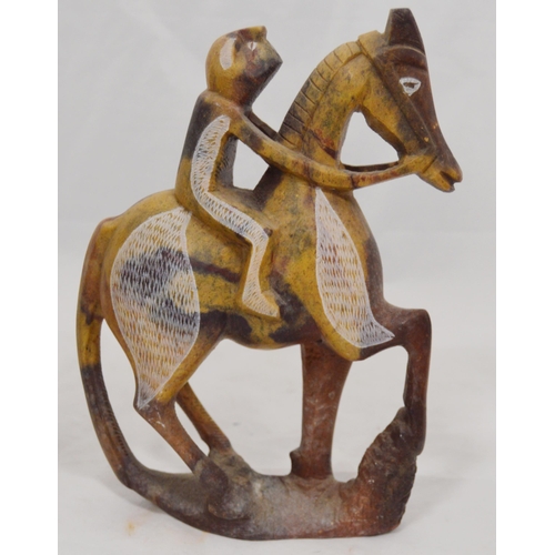 307 - Three carved soapstone Mbigou stone sculptures, origin Gabon, Africa, modelled as riders on horsebac... 