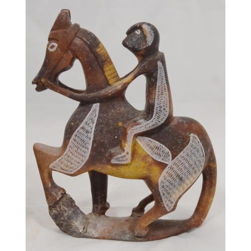 307 - Three carved soapstone Mbigou stone sculptures, origin Gabon, Africa, modelled as riders on horsebac... 