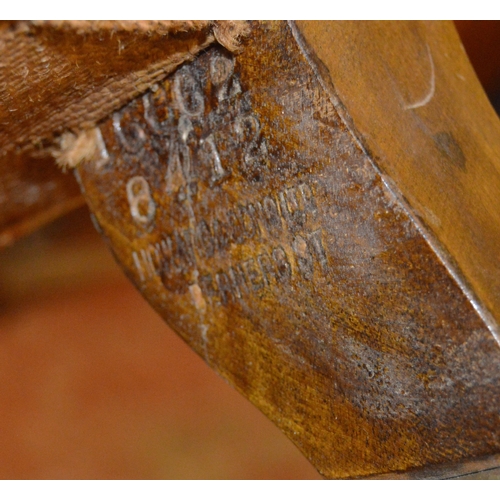 457 - Howard & Sons of LondonNear-pair of walnut armchairs, c. early 20th century, upholstered in peri... 