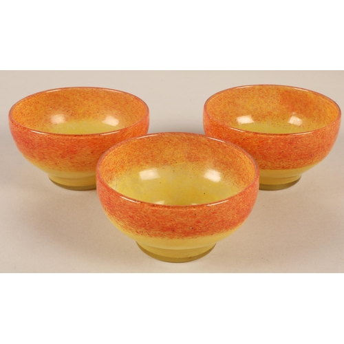 219 - Three Vasart orange and yellow glass bowls, signed to base