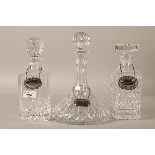 224 - Three cut glass decanters, whisky, brandy, and sherry