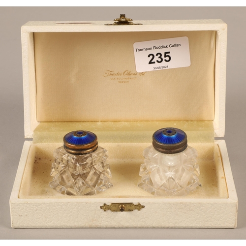 235 - Cased set of two Norwegian cut glass salt and pepper pots with blue enamelled silver tops 