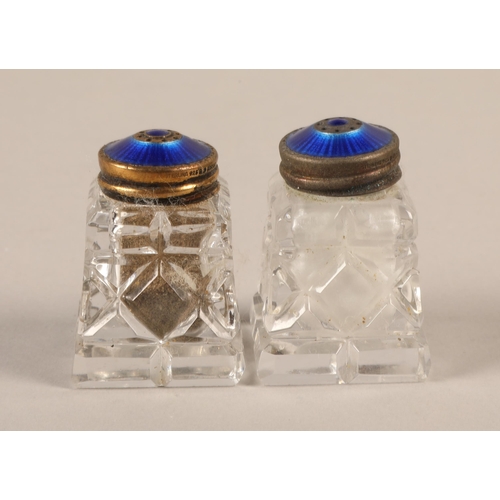 235 - Cased set of two Norwegian cut glass salt and pepper pots with blue enamelled silver tops 