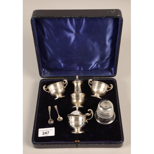 247 - Cased silver cruet set, Birmingham 1903, two silver salt spoons, and a white metal 'Just a Thimblefu... 