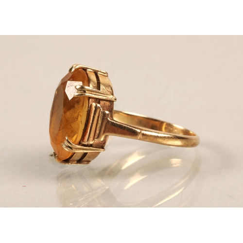 59 - Gold ring, illegibly marked, set with a citrine, ring size J/K