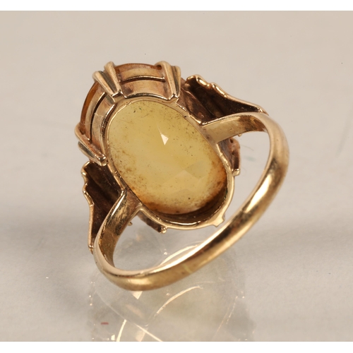 59 - Gold ring, illegibly marked, set with a citrine, ring size J/K