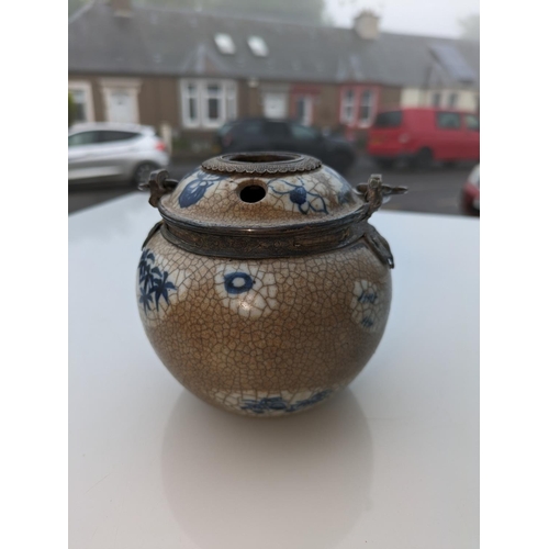 234 - Oriental blue and white pottery pot with metal handle and metal mounts in the form of hanging bats, ... 