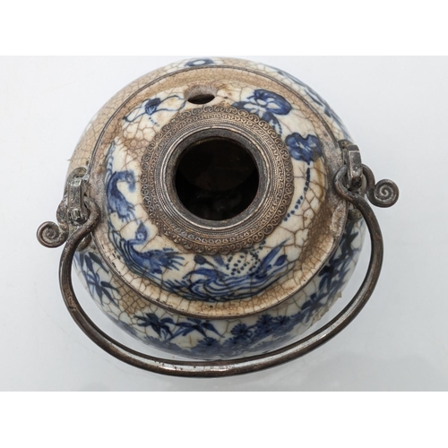 234 - Oriental blue and white pottery pot with metal handle and metal mounts in the form of hanging bats, ... 