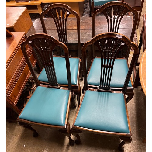 590 - Four mahogany splat back dining chairs with blue leather upholstery