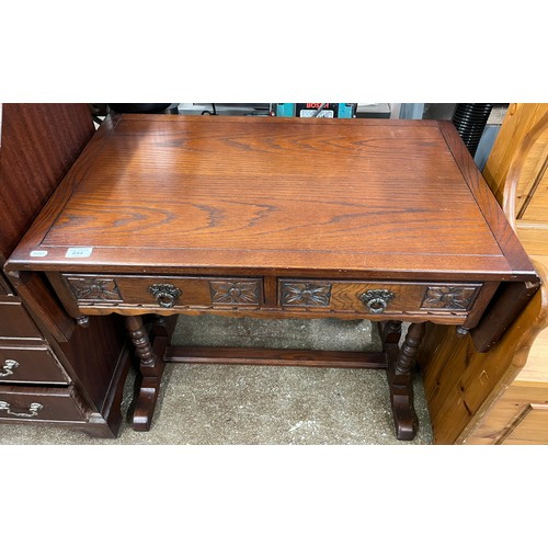 644 - Carved drop-leaf oak table with two fitted drawers, 69cm h, 53.5cm d, 125cm w fully extended