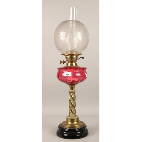 494 - Brass based oil lamp, 70cm h including glass shades