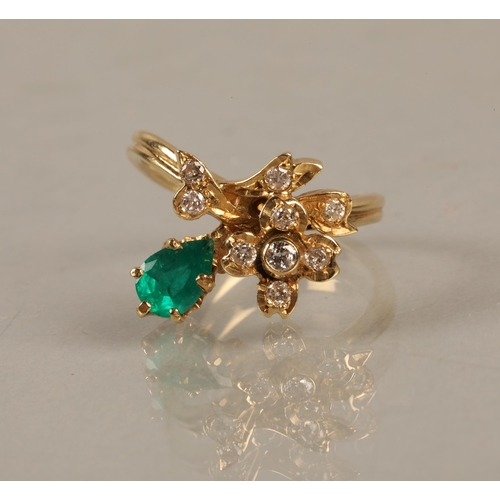 138 - Yellow metal ring set with a green gem and diamonds in a flower design, gross weight 4.5g, ring size... 