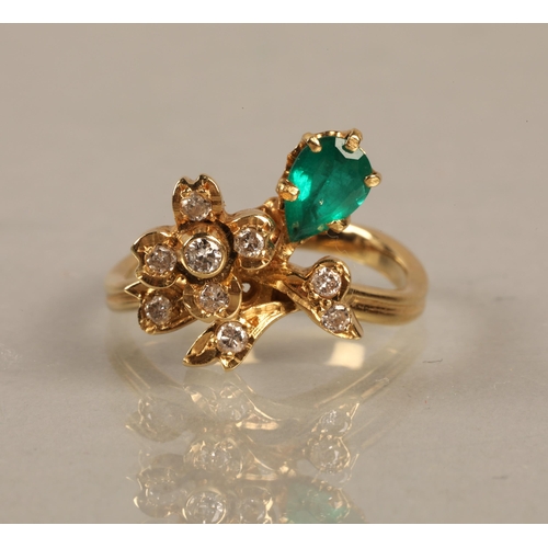 138 - Yellow metal ring set with a green gem and diamonds in a flower design, gross weight 4.5g, ring size... 