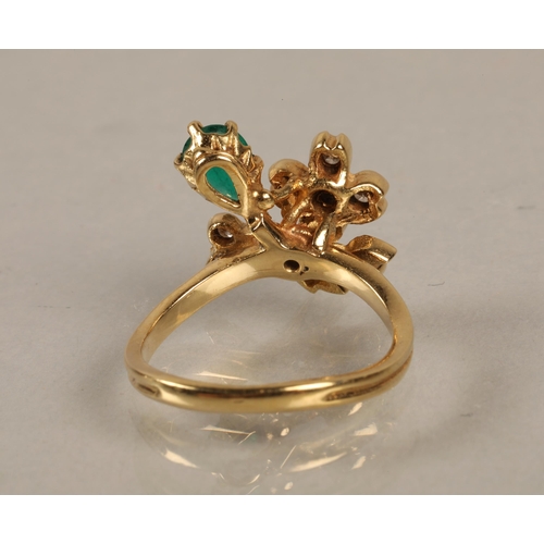 138 - Yellow metal ring set with a green gem and diamonds in a flower design, gross weight 4.5g, ring size... 