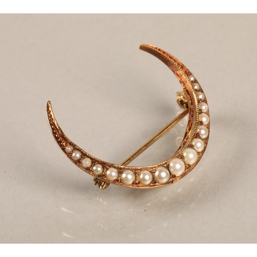 139 - 9ct gold crescent moon brooch set with seed pearls, gross weight 2.3g