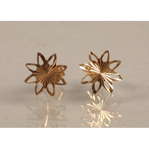 77 - Pair unmarked yellow metal eight-sided star shape studs, gross weight 0.2g