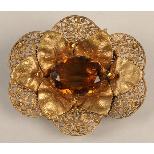 97 - Vintage brass coloured brooch with filigree and leaf detail, set with orange gems, 7cm x 6cm