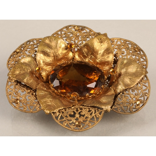 97 - Vintage brass coloured brooch with filigree and leaf detail, set with orange gems, 7cm x 6cm