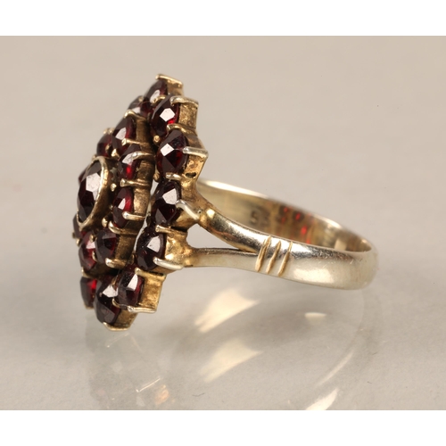 99 - Silver ring set with a cluster of garnets, ring size J