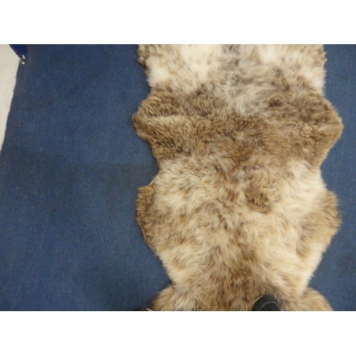 106 - Two simulated animal skin rugs.  (2)