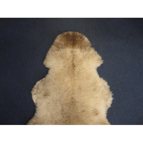 106 - Two simulated animal skin rugs.  (2)