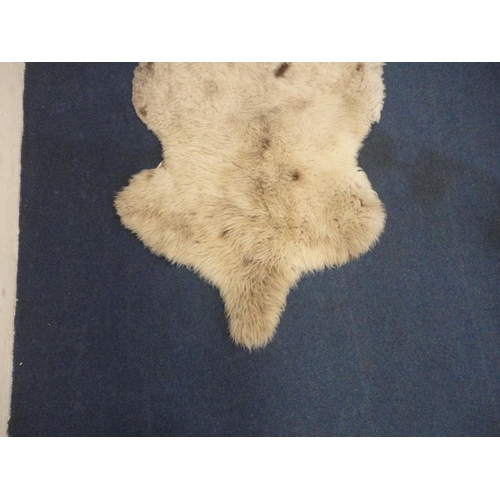 106 - Two simulated animal skin rugs.  (2)