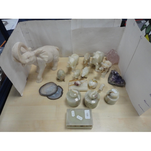 109 - Group of onyx and similar sculptures in the form of elephants and others, amethyst geode, agate etc.