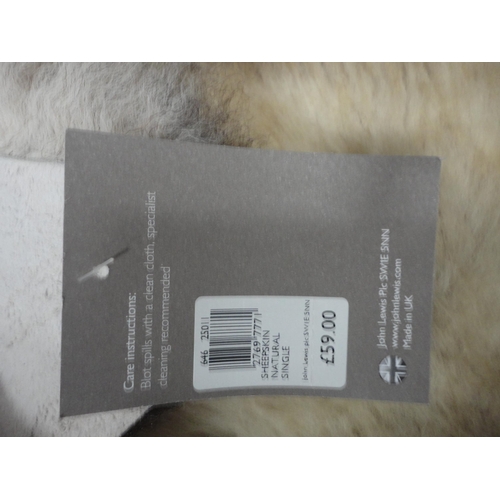 114 - Two John Lewis sheepskin rugs.  (2)