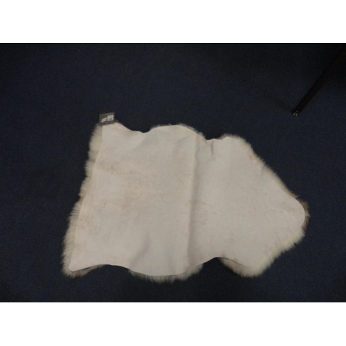 114 - Two John Lewis sheepskin rugs.  (2)