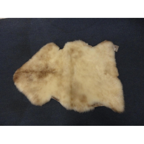 114 - Two John Lewis sheepskin rugs.  (2)