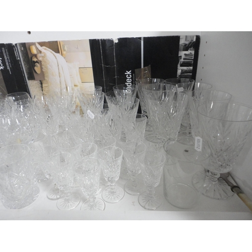 137 - Crystal to include brandy glasses, wine glasses, knife rests, dishes etc (one shelf).