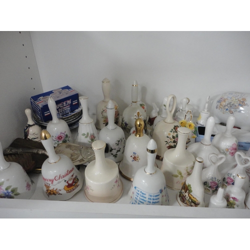 148 - Bell ornaments, Aynsley china, modern figures, plaques, trinket boxes etc (three shelves).