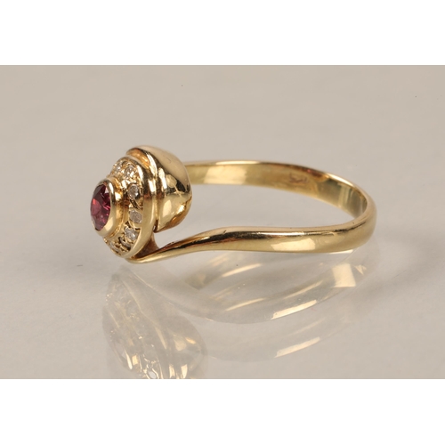 149 - Yellow metal ring illegibly marked, set with a central pink stone surrounded by diamonds, gross weig... 