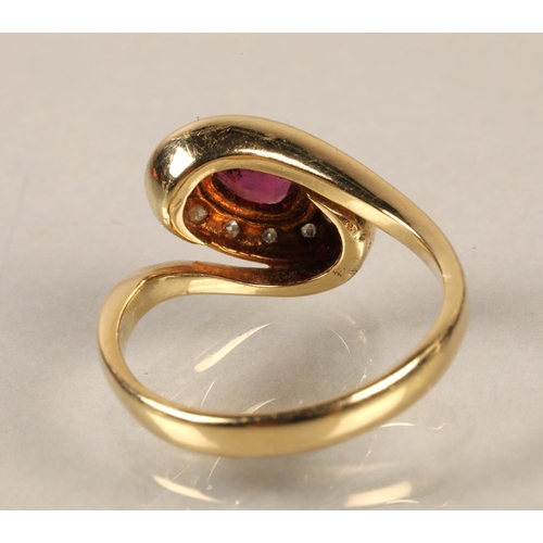 149 - Yellow metal ring illegibly marked, set with a central pink stone surrounded by diamonds, gross weig... 