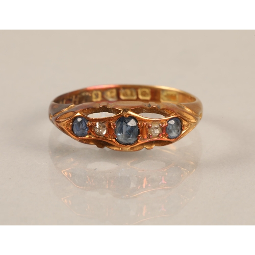 186 - 18ct gold ring set with diamonds and blue gems, gross weight 2.6g, ring size M