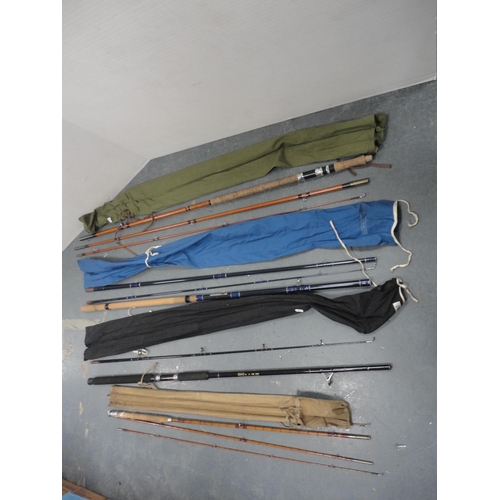 190 - Four assorted fishing rods to include a BMS split cane example, all with carry bags.  (4)