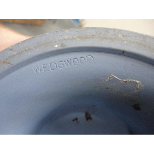 194 - Wedgwood Jasper ware pedestal bowl and a majolica armorial wall plaque.  (2)