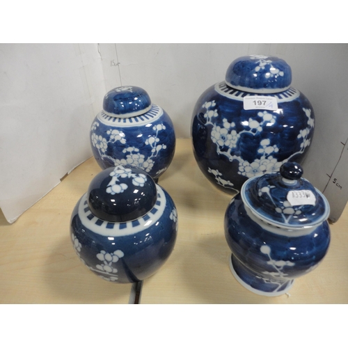 197 - Four Chinese Kangxi-style prunus jars and covers of graduated sizes, three with double blue concentr... 