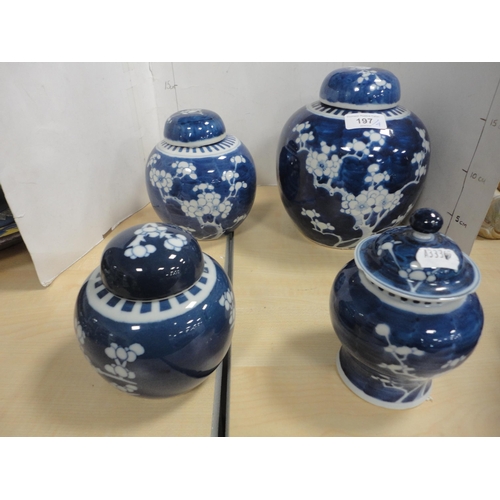 197 - Four Chinese Kangxi-style prunus jars and covers of graduated sizes, three with double blue concentr... 