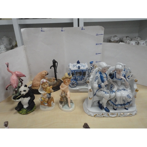 216 - Two Goebel figures, Country Artists giant panda figure, no. 04941, and a pig with water pump group, ... 