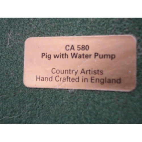 216 - Two Goebel figures, Country Artists giant panda figure, no. 04941, and a pig with water pump group, ... 