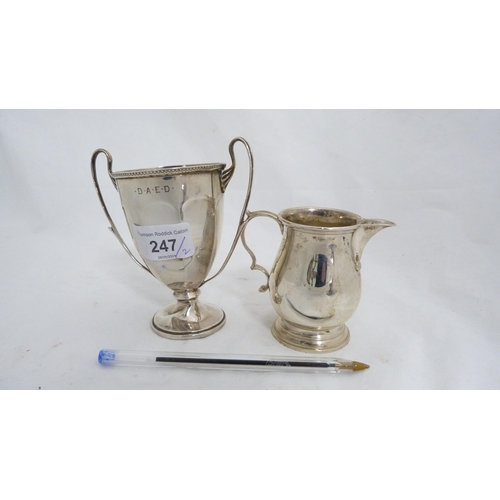 247 - Small silver twin-handled prize cup and a silver cream jug, 182g gross.  (2)