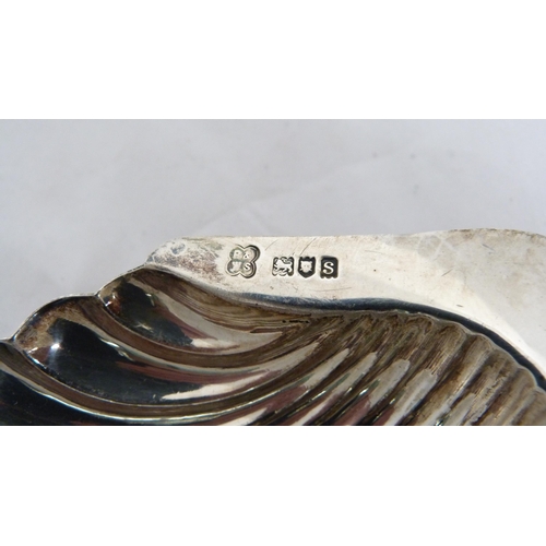 249 - Silver shell-shaped butter dish and a silver cruisie lamp, 144g gross.