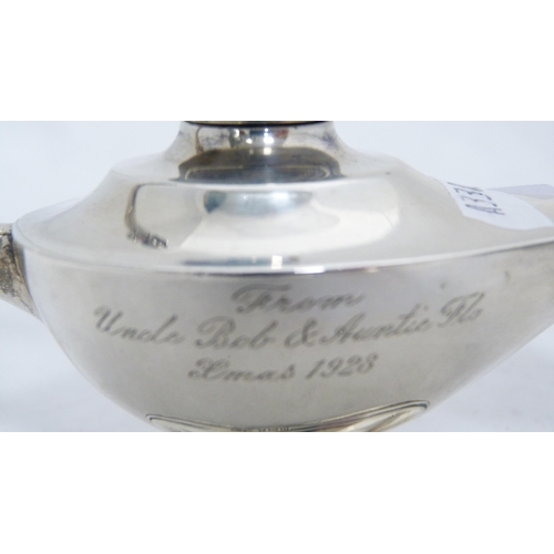 249 - Silver shell-shaped butter dish and a silver cruisie lamp, 144g gross.