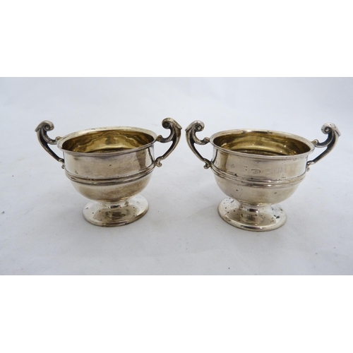 253 - Silver sugar bowl and a pair of small silver prize cups, 152g gross. (3)